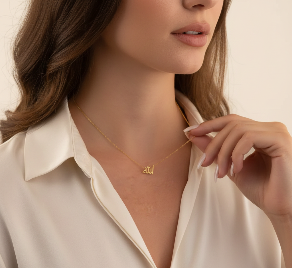 Woman wearing a gold necklace with a small pendant